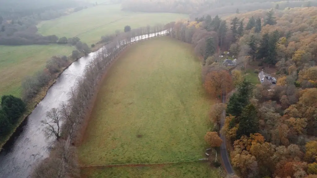 Aerial photography of a large field with the river Don on the left and house on the right